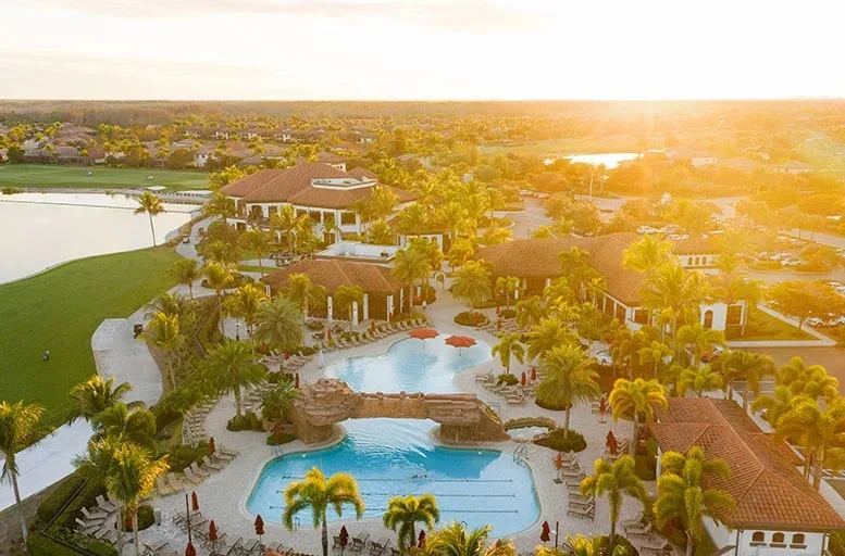 Aerial of the Bonita National clubhouse and resort pool at sunrise.
