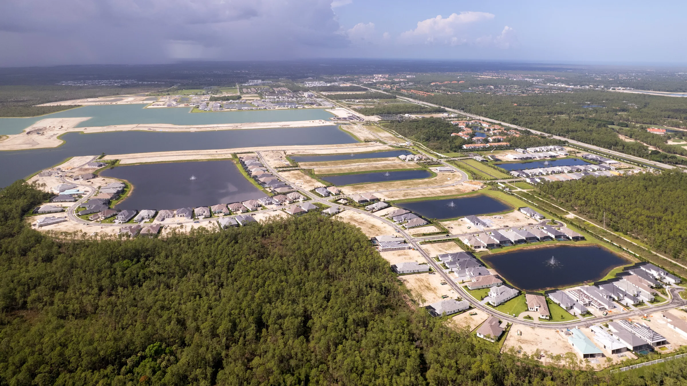 Aerial view of Caymas neighborhoods and lakes, Naples (June 2025).