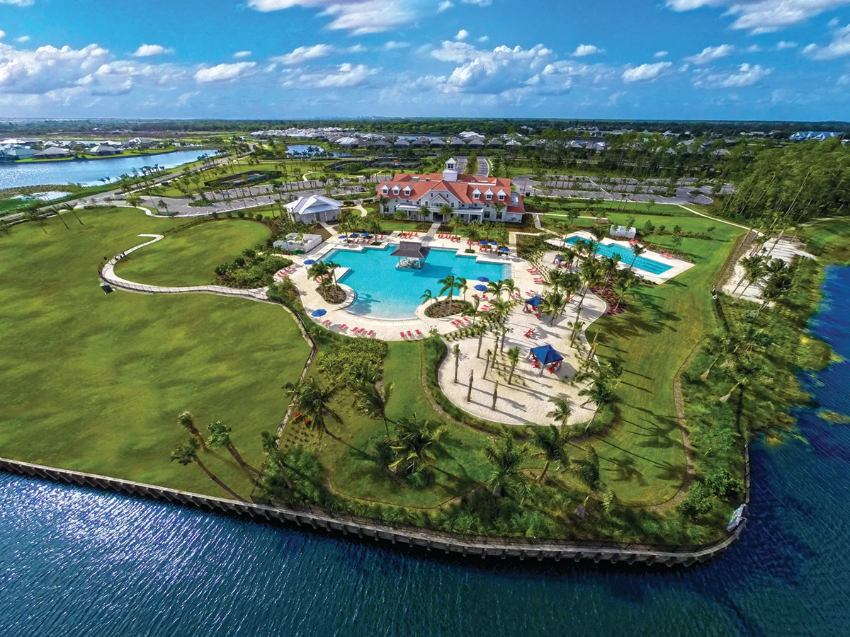 Aerial view of The Isles Club, resort pool and the Cypress Waterway