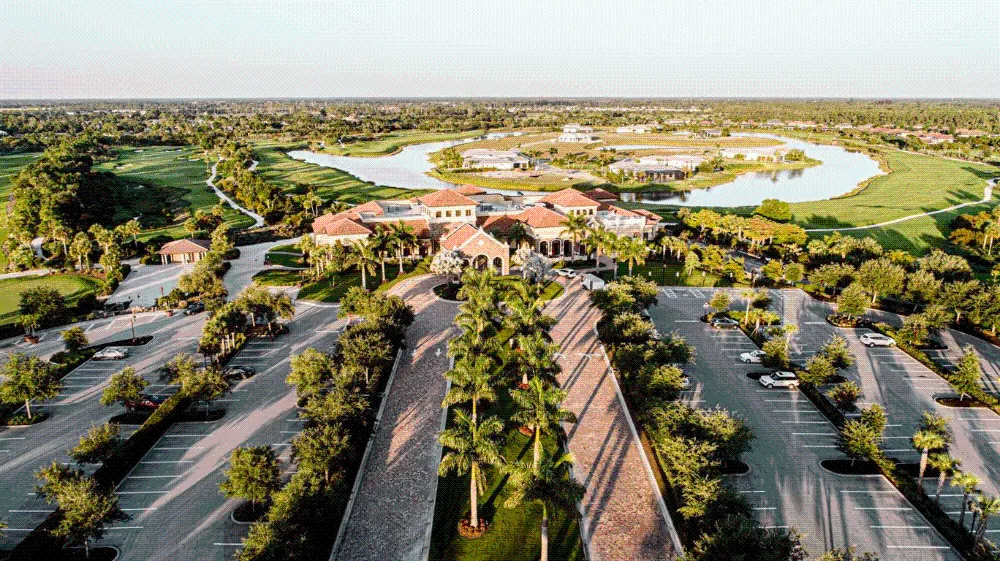 Aerial view of the palm-lined clubhouse arrival at Treviso Bay, Naples.