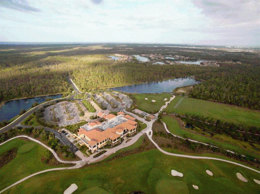 Aerial view of the Treviso Bay clubhouse, golf course and lakes, Naples.