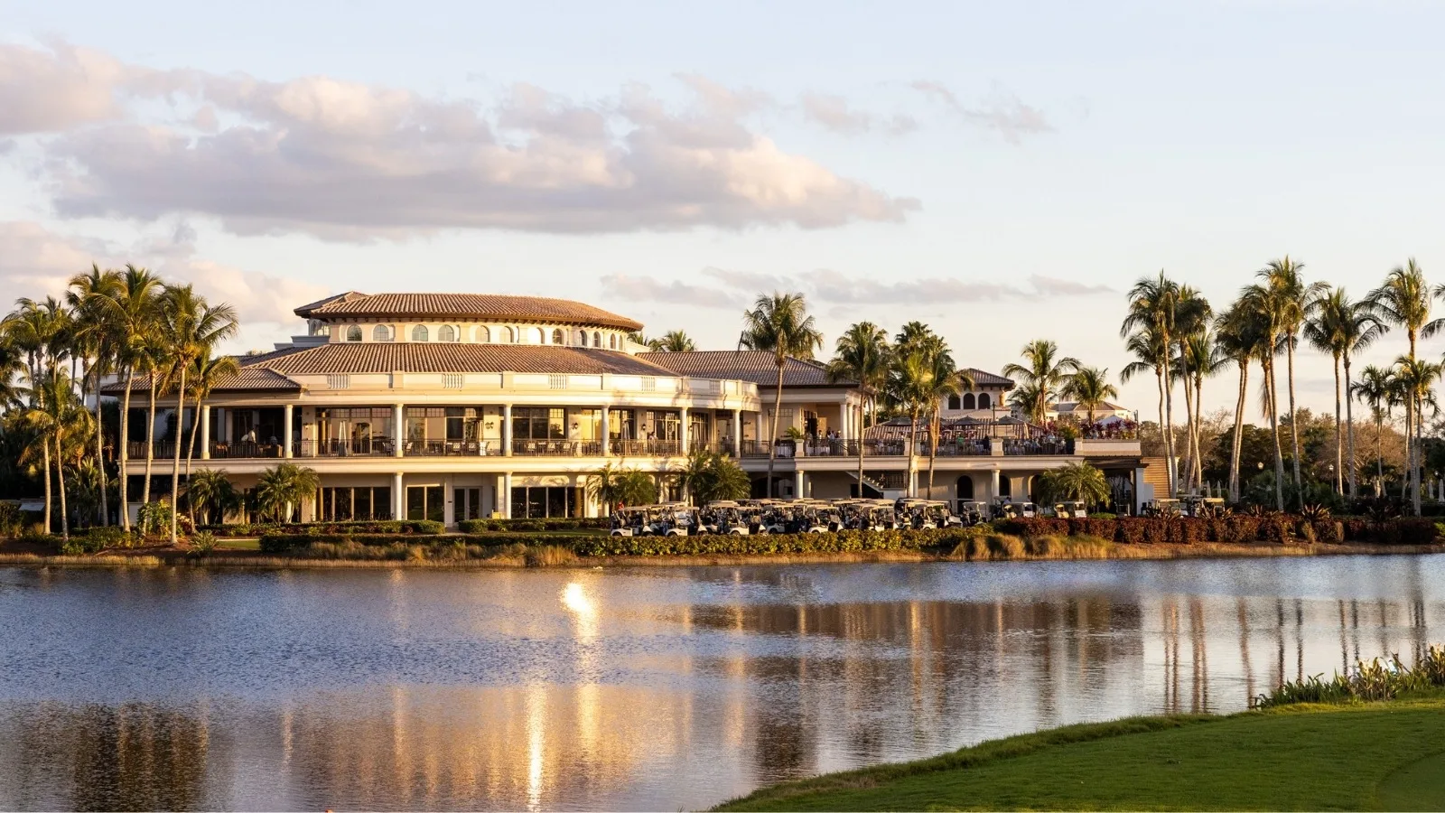 Clubhouse across the lake at sunset, The Colony Golf and Country Club (official).