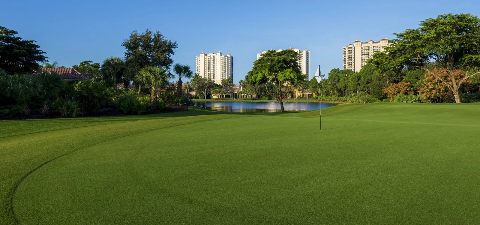Practice green / course view toward residences at The Colony (official).