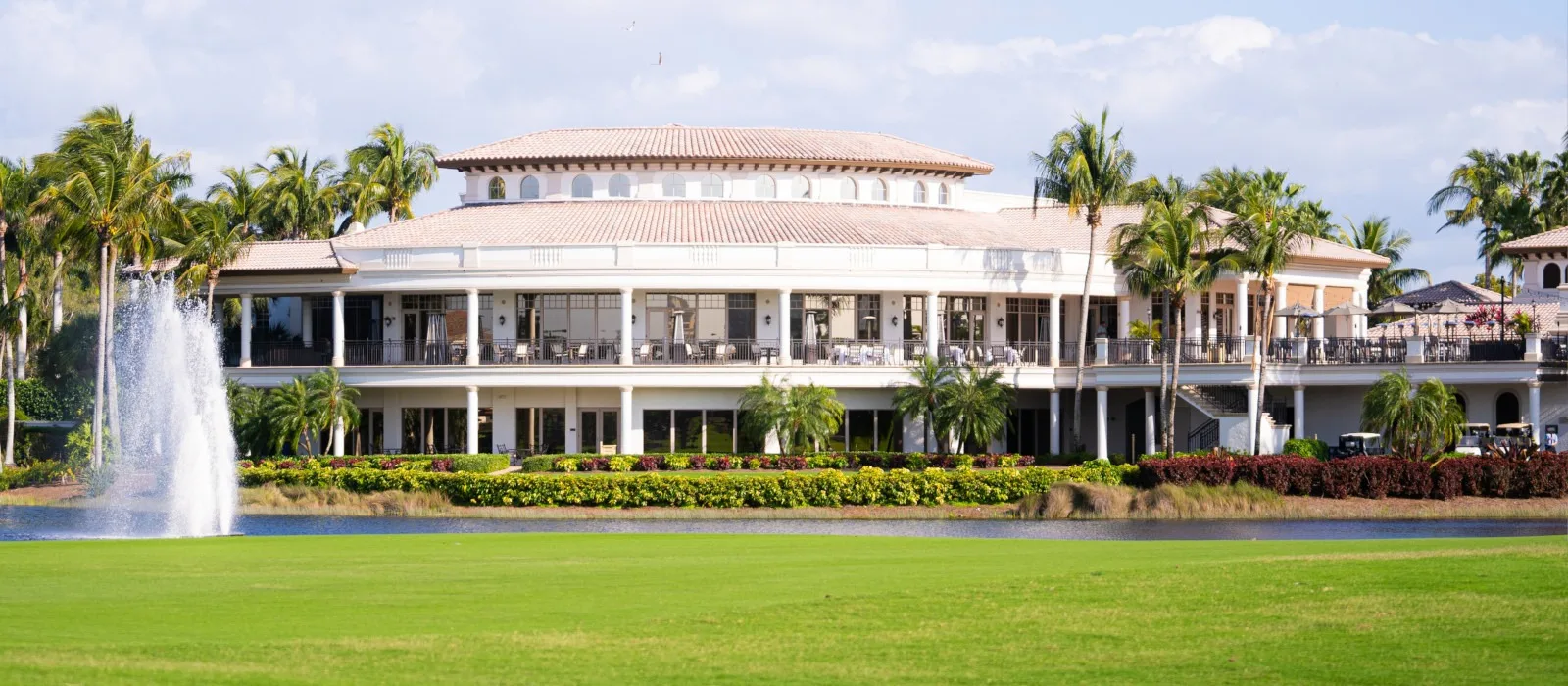 Clubhouse and lake fountain from the course, The Colony Golf and Country Club.