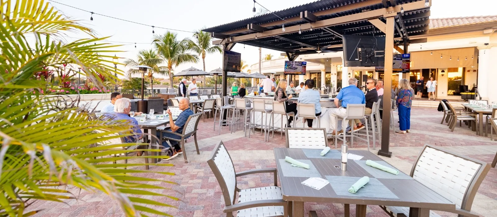 Outdoor patio lounge at dusk, The Colony Golf and Country Club (official).
