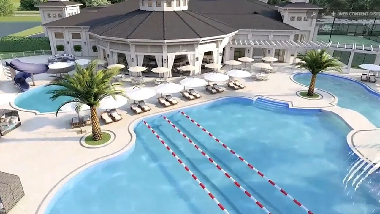 Resort-style lap and leisure pool beside the clubhouse at Shadow Wood, Estero (official club site).