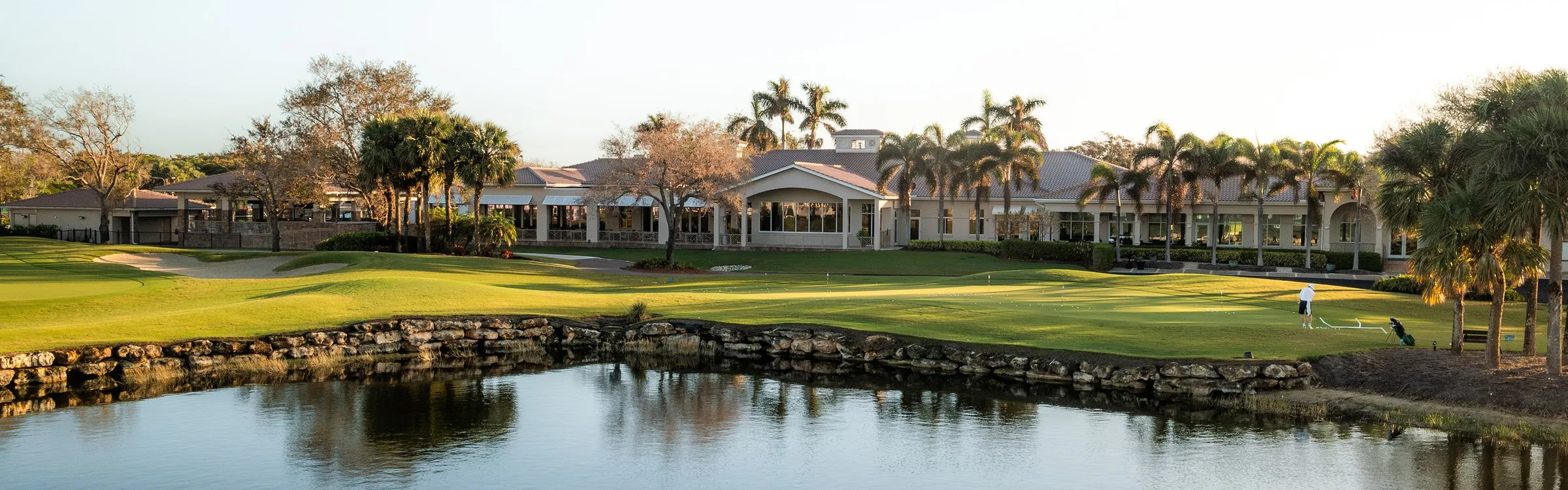 Clubhouse across the golf lake at Spring Run, Estero (official club site).