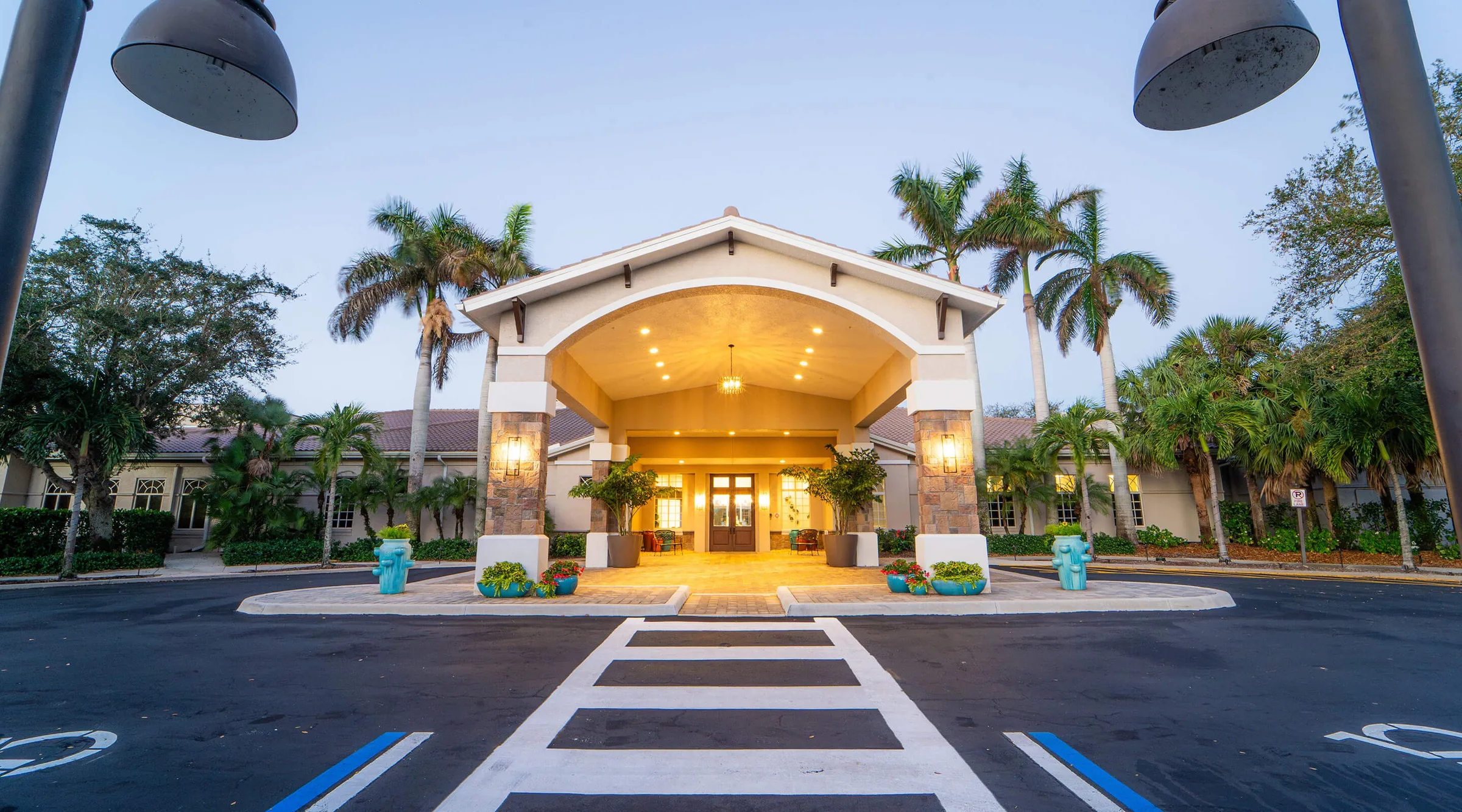 Clubhouse entrance at dusk, Spring Run Golf Club, Estero (official club site).