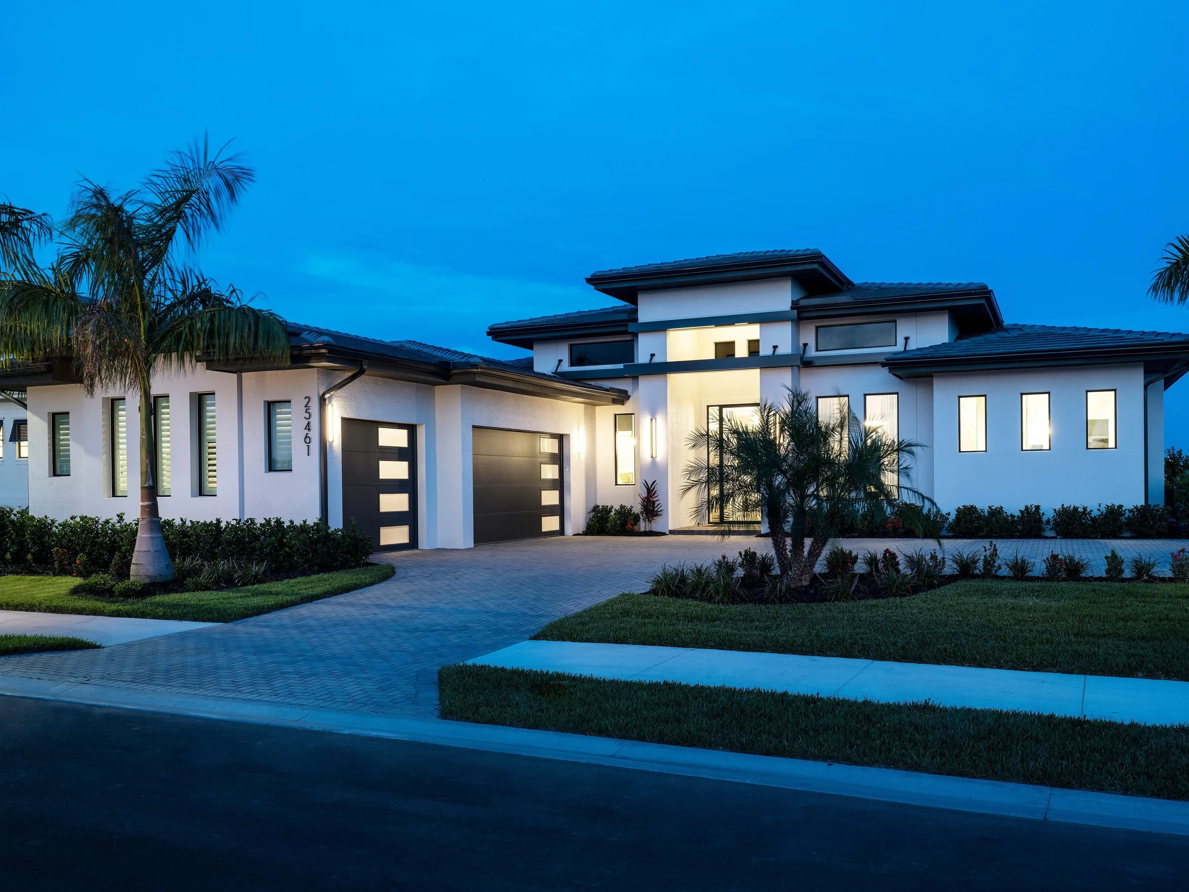 Gardenia II home by Stock Luxury Homes at Vivid Shores at dusk.