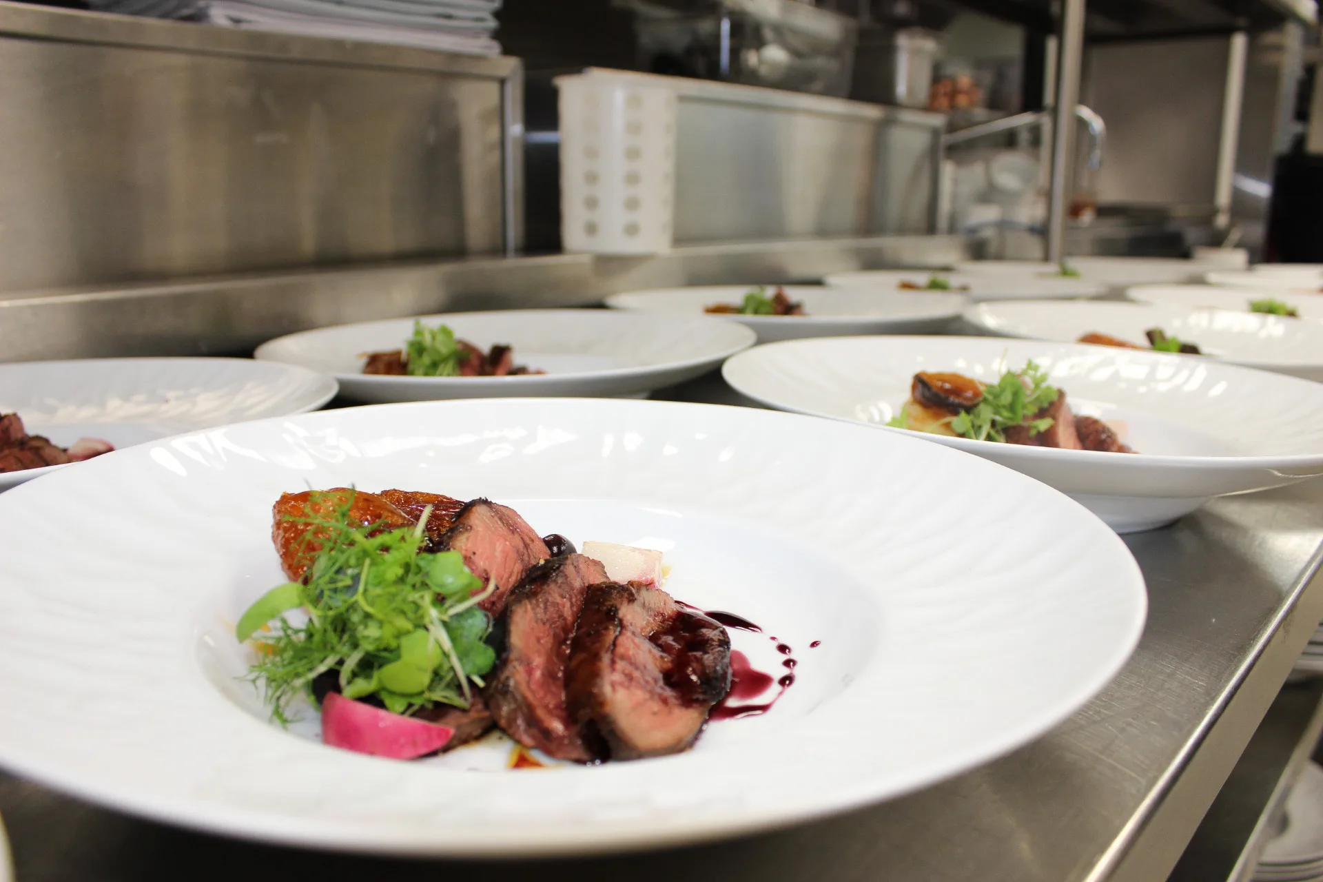 Club dining at The Club at Barefoot Beach (official).