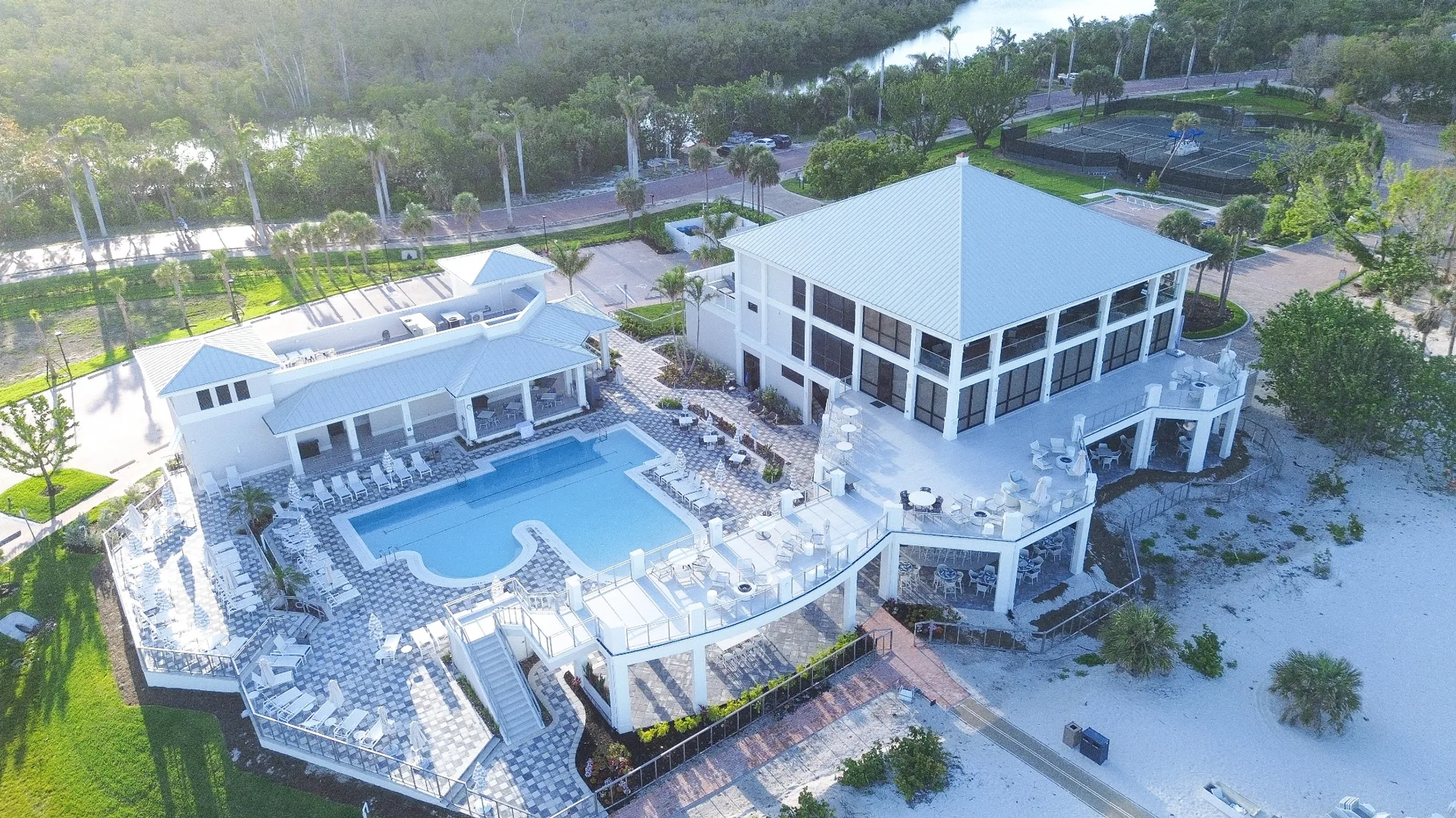 Resort pool aerial, The Club at Barefoot Beach (official Club Life page).