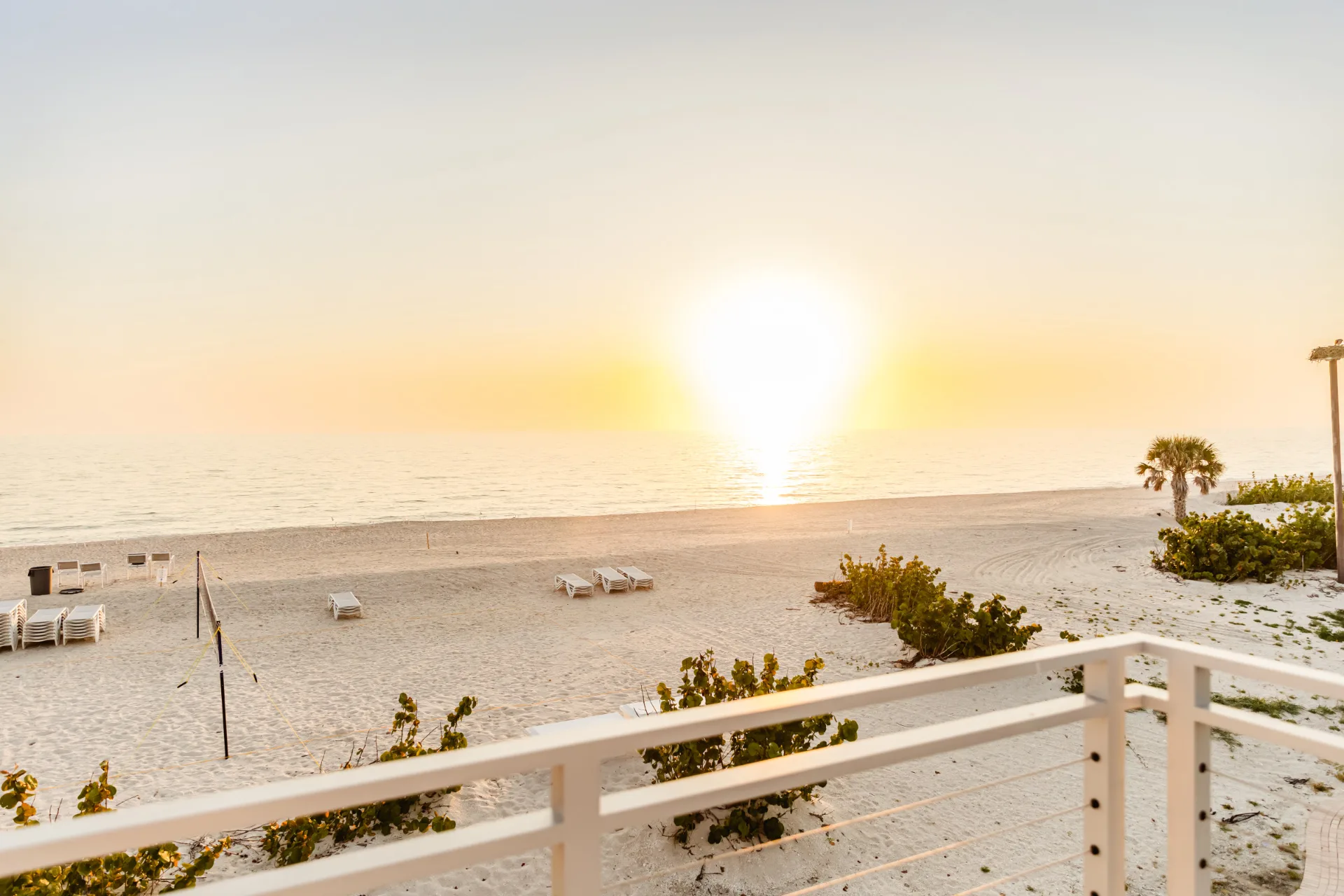 Sunrise beach view at The Club at Barefoot Beach (official).