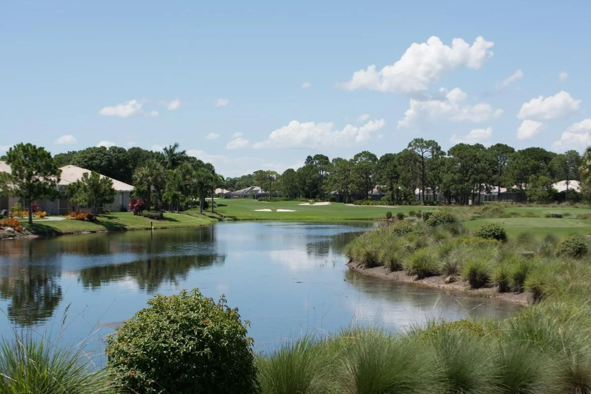 Lake and golf course view at Highland Woods, Bonita Springs (official club site).