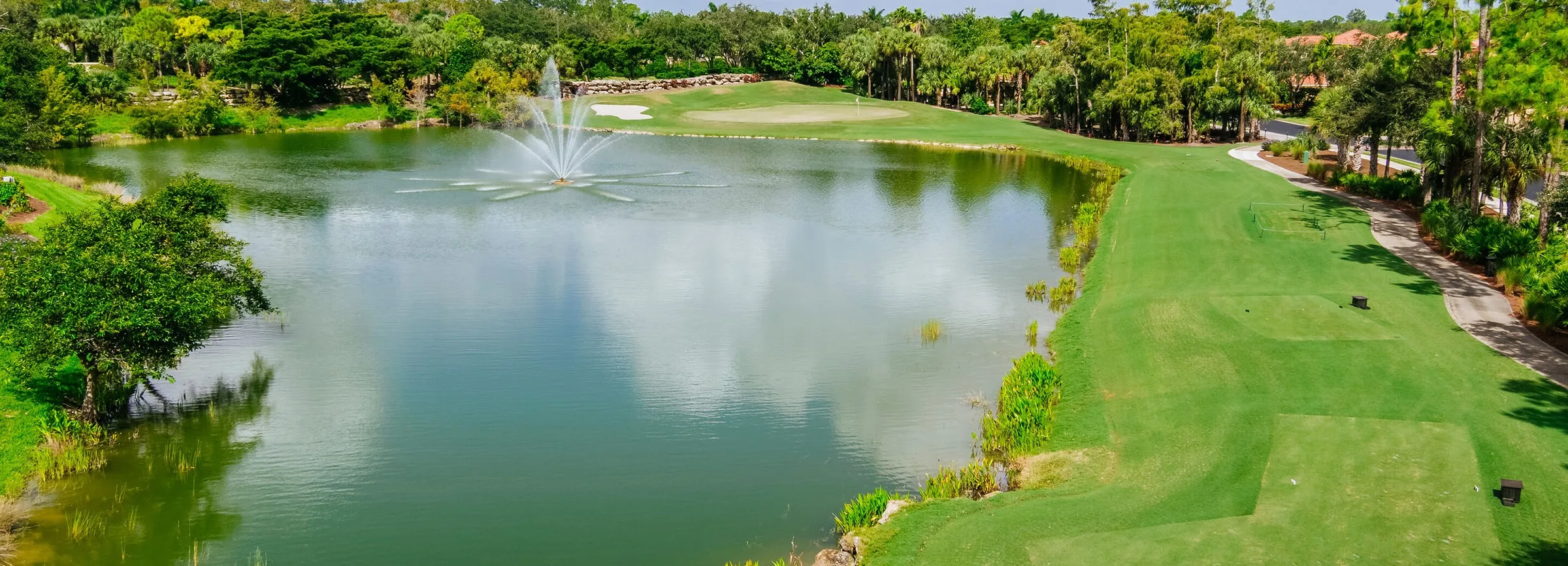 Lake and golf landscape at Vasari Country Club (official club site).