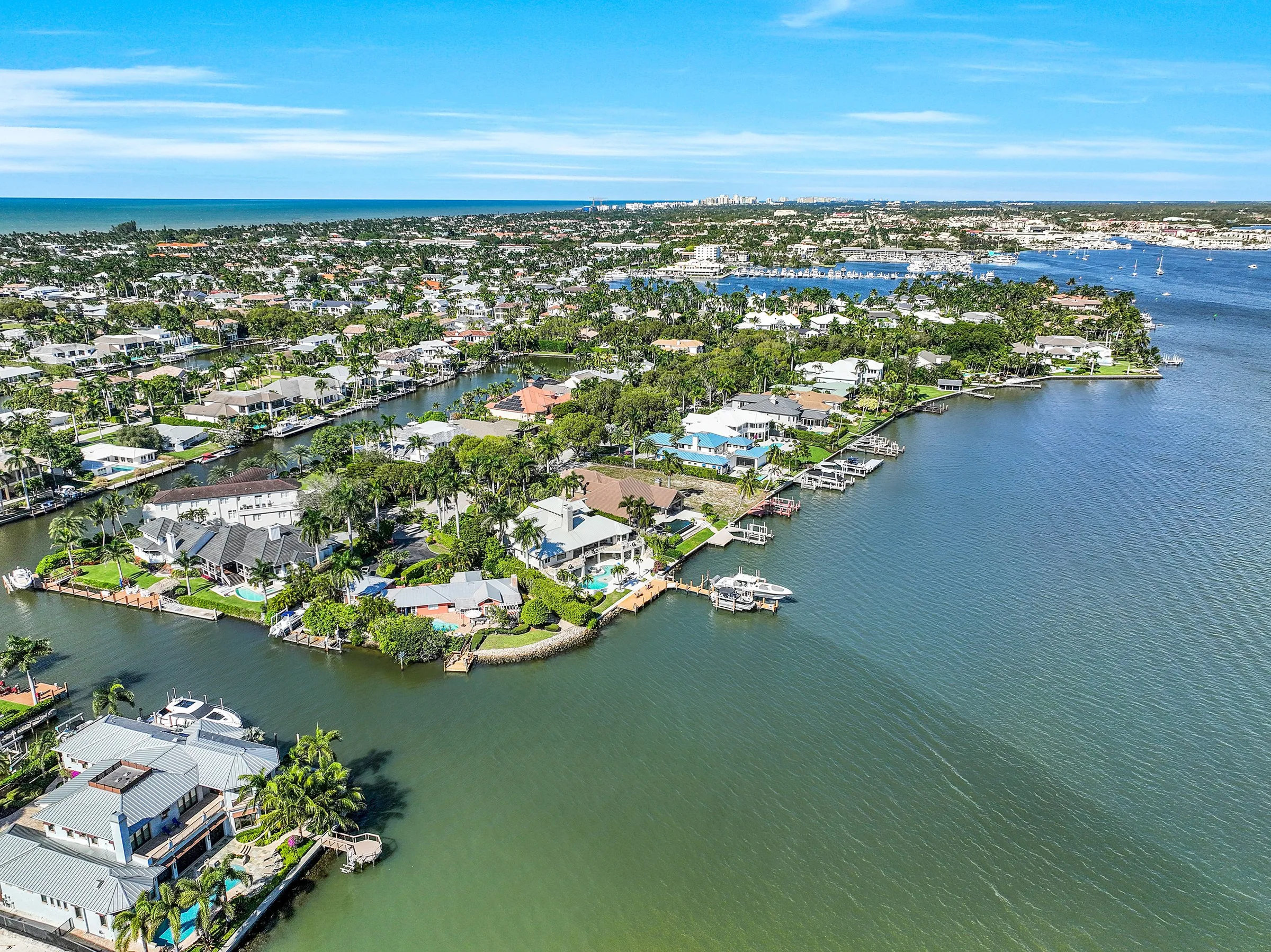 Aerial canals and waterfront homes in Aqualane Shores, Naples (official association site).