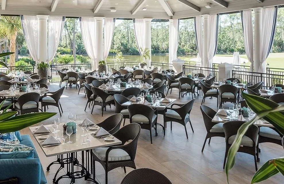 Mediterra covered terrace dining overlooking the lake