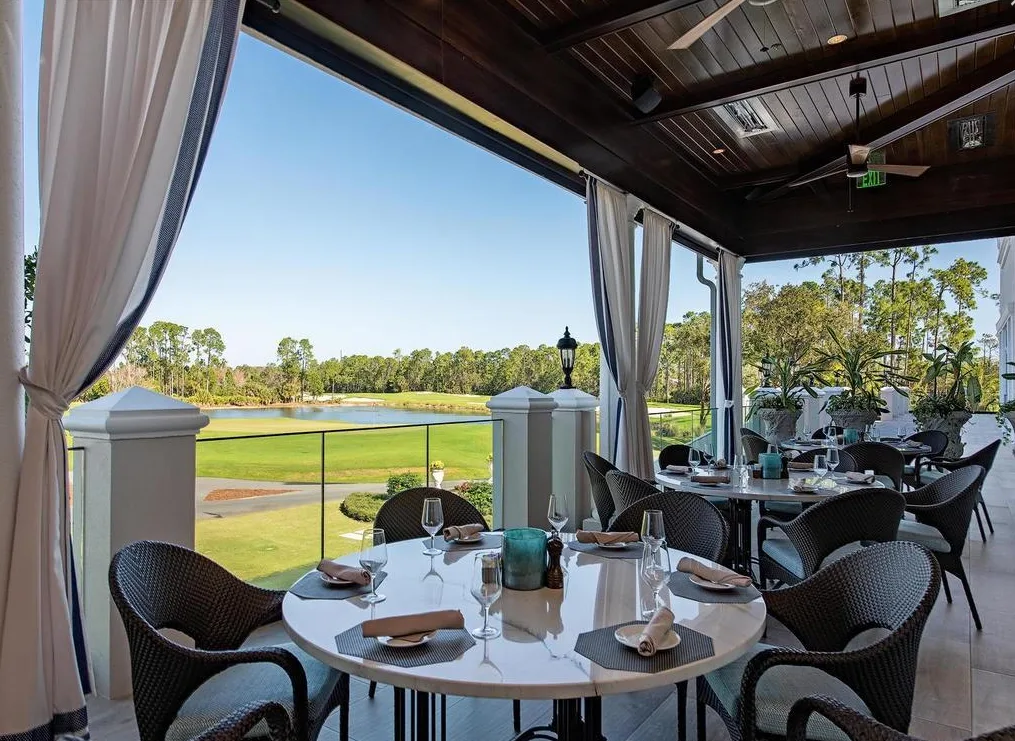 Mediterra terrace dining with golf course view