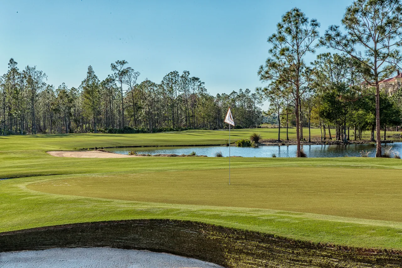 Pine-framed green and pond on the Gold Course at Tiburon Golf Club, Naples.