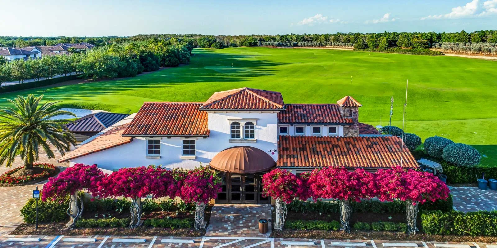 Clubhouse, gardens and golf course at Talis Park Golf Club, Naples.