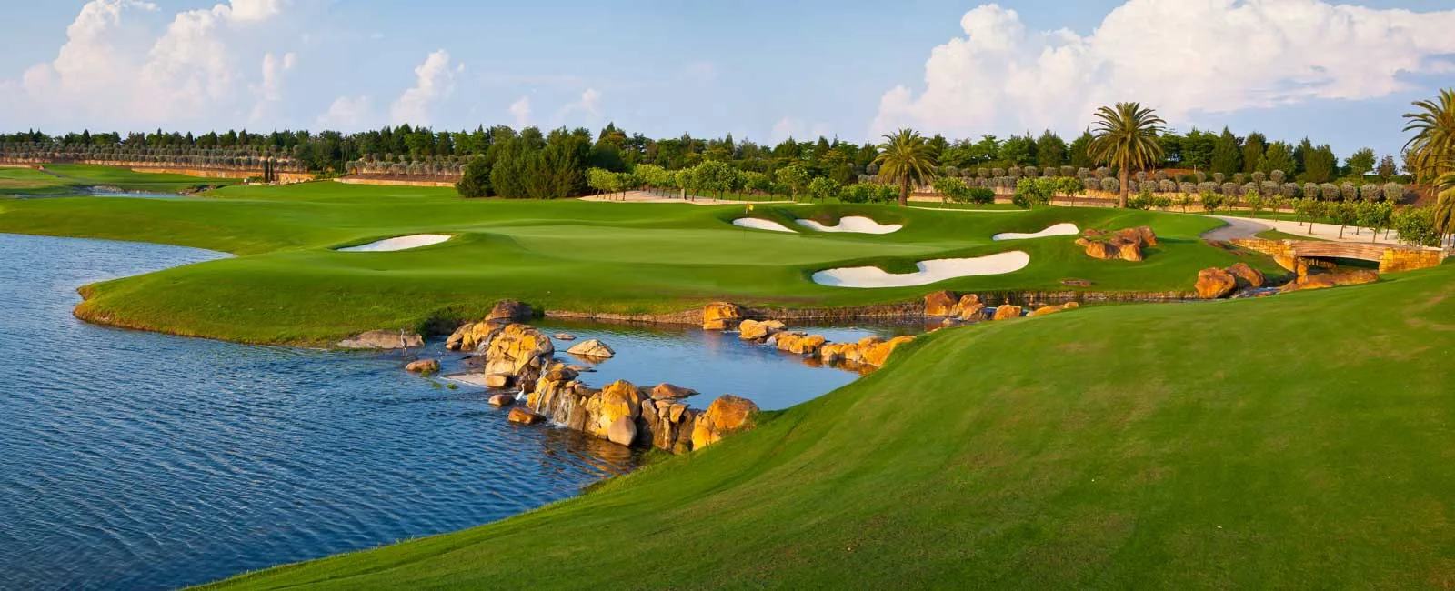 Green and rock water feature on the Talis Park golf course, Naples.