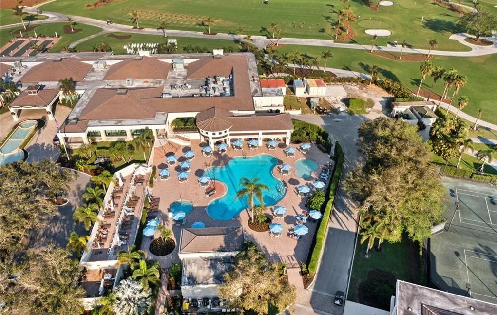 Aerial of the Vineyards Country Club clubhouse and resort pool with golf beyond