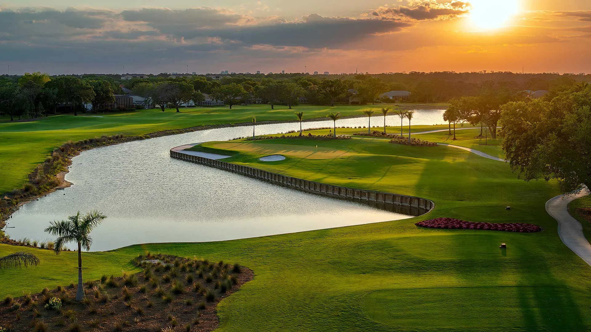 Golf course lake and fairway at sunset, Vineyards Country Club (official).