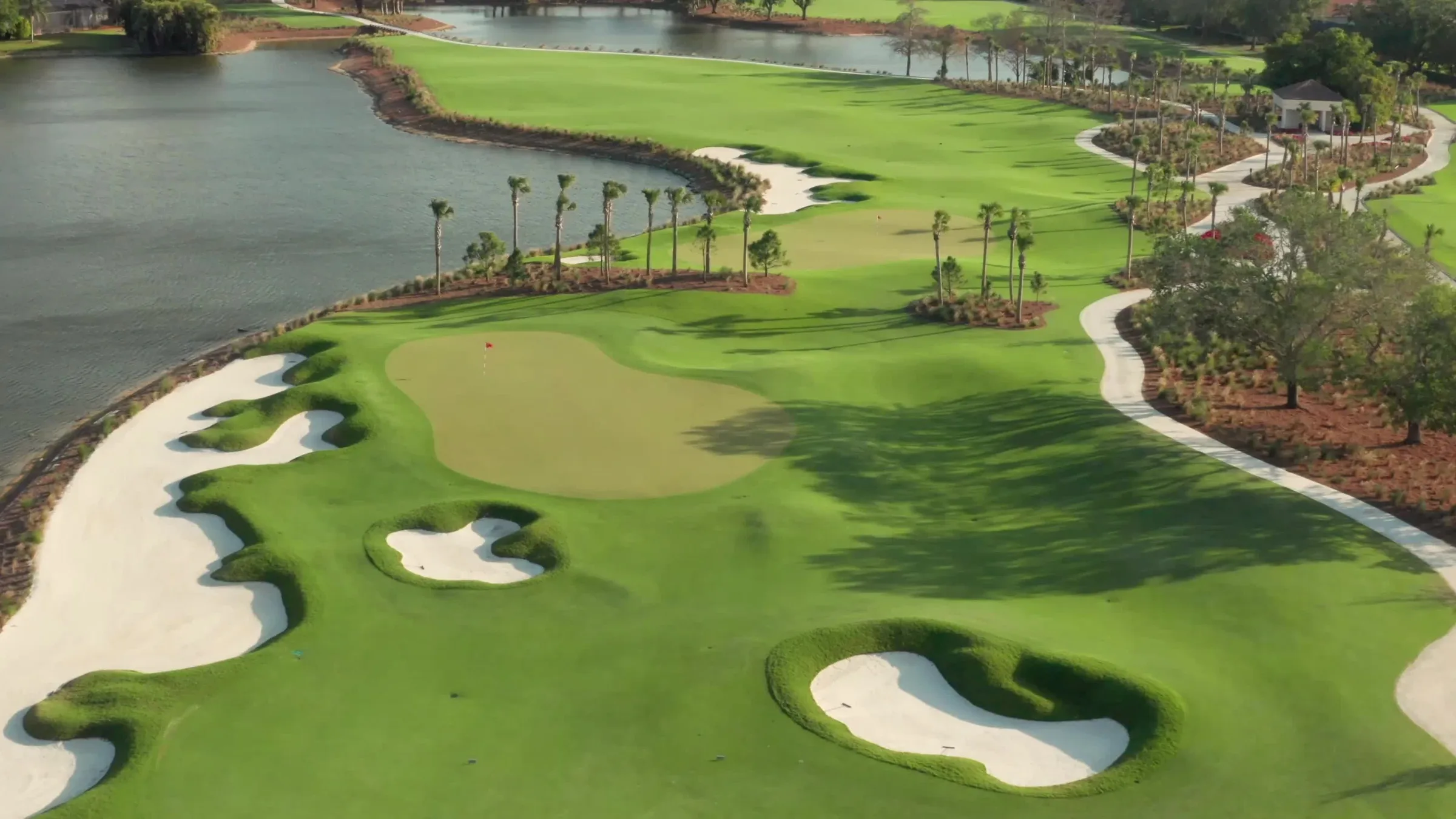 Aerial golf green and bunkers at Vineyards Country Club, Naples (official club site).
