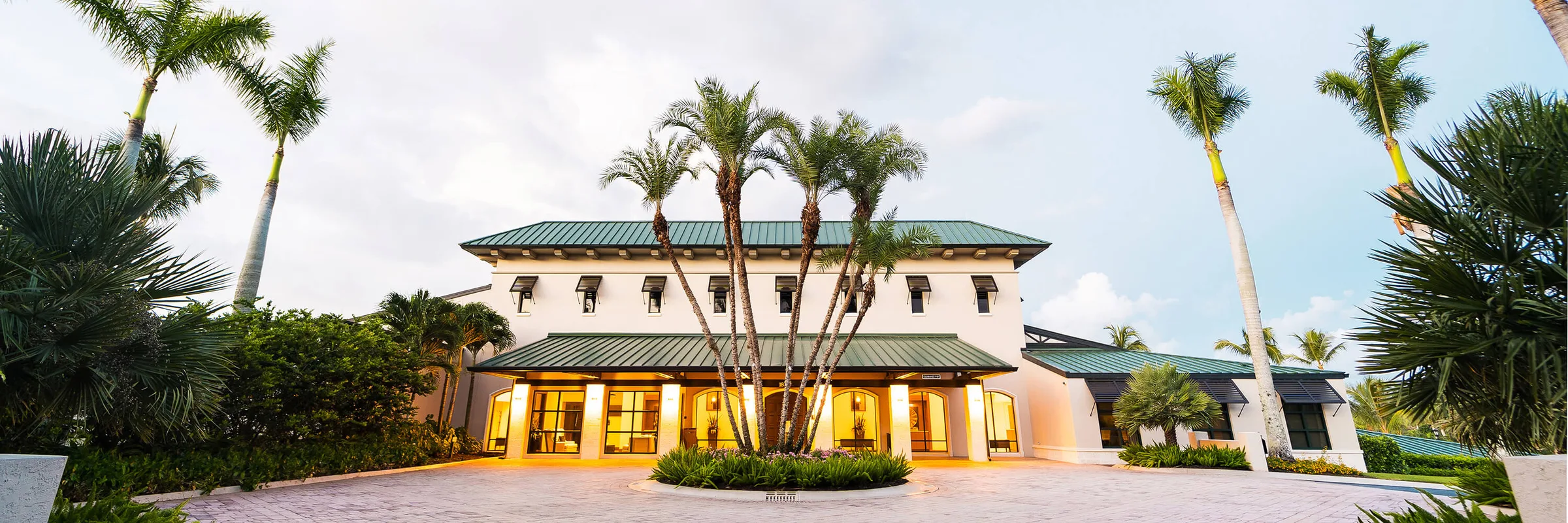 Clubhouse entry drive at dusk, Pelican Marsh Golf Club, Naples.