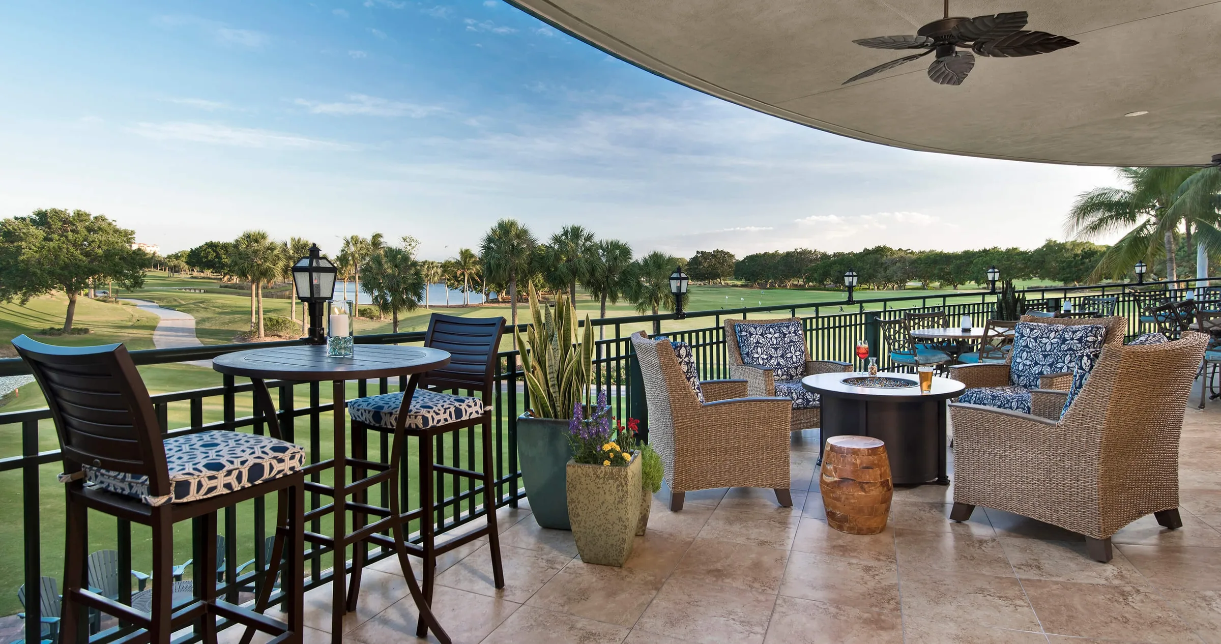 Covered terrace bar overlooking the course at Pelican Marsh Golf Club, Naples (official club site).