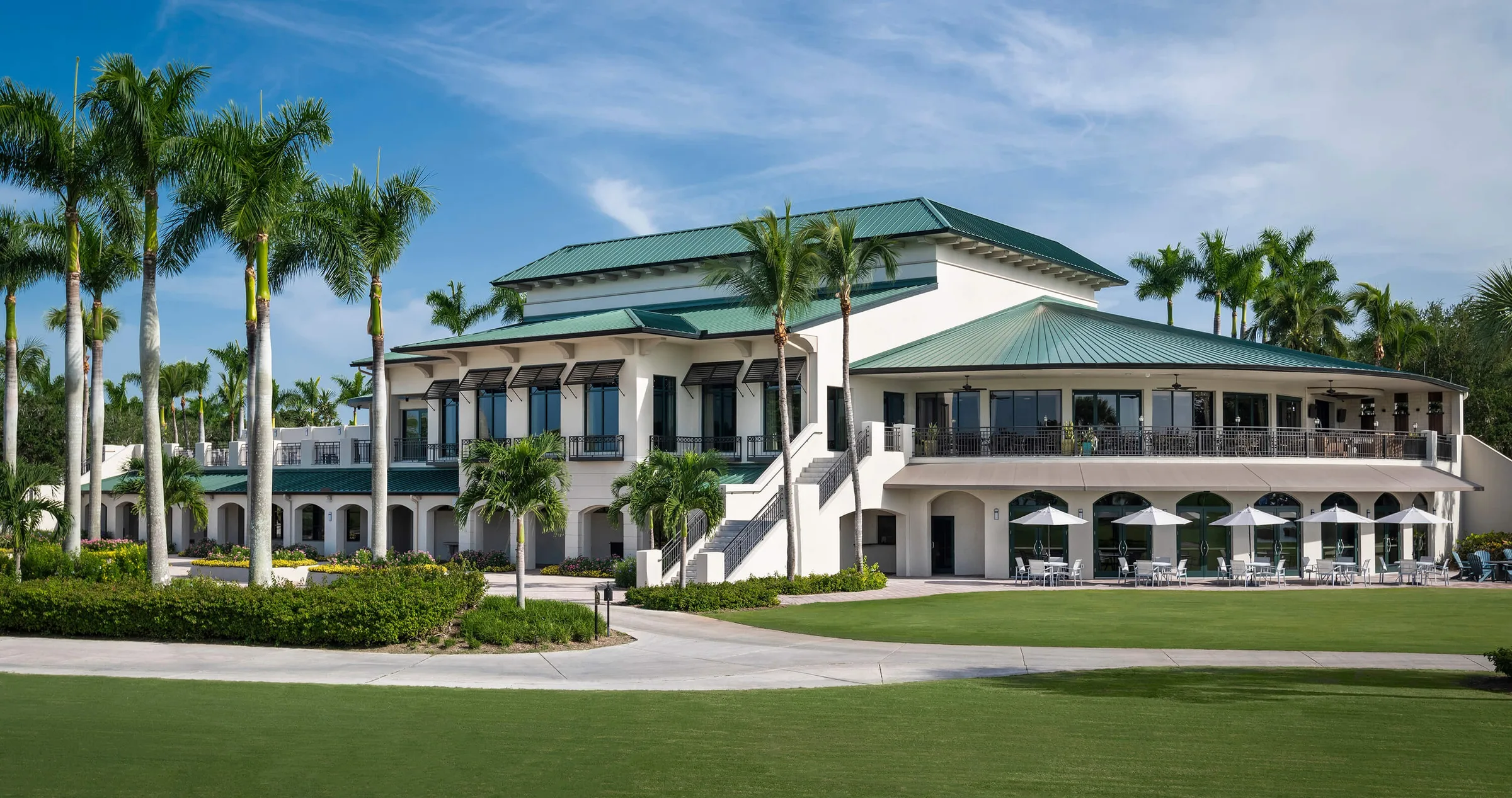Clubhouse exterior at Pelican Marsh Golf Club, Naples (official club site).