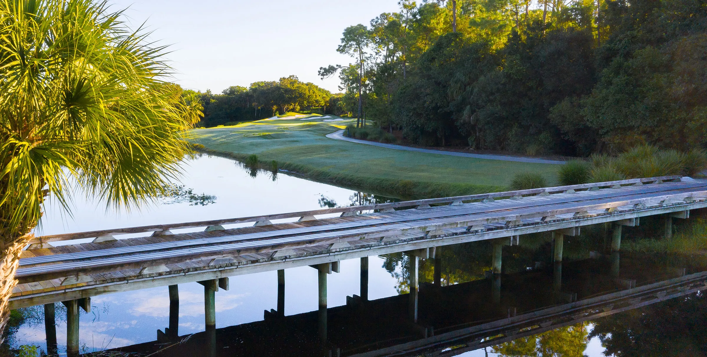 Cart footbridge over a lake on the Pelican Marsh golf course, Naples.