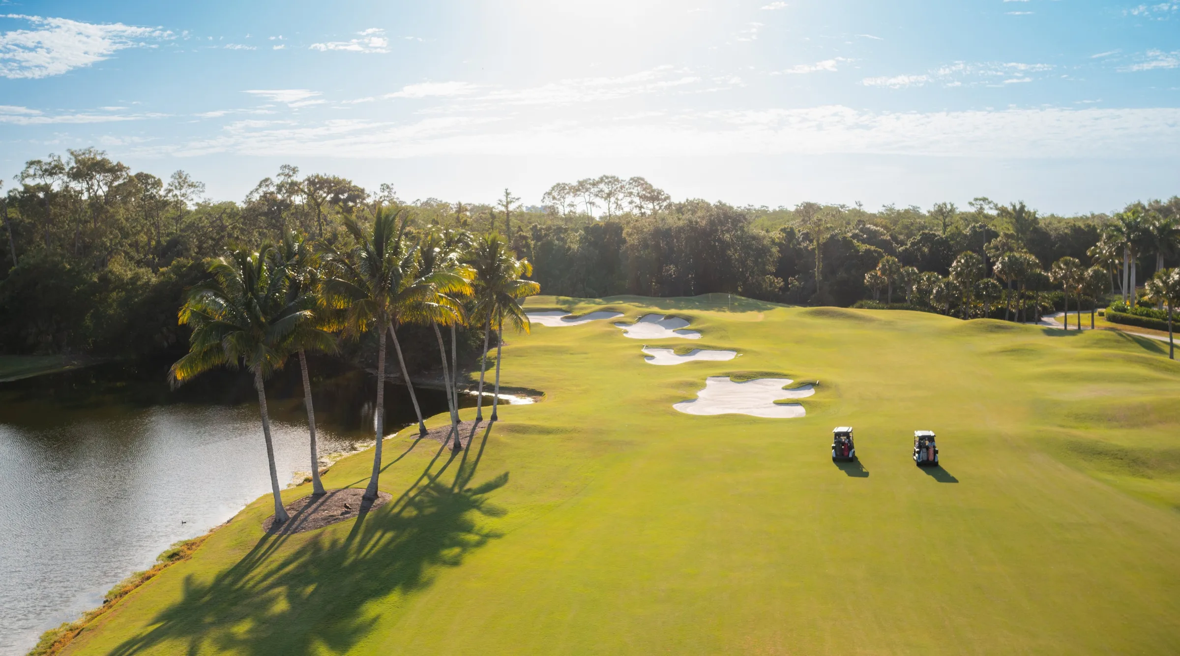 Palm-lined fairway at Pelican Marsh Golf Club, Naples (official club site).
