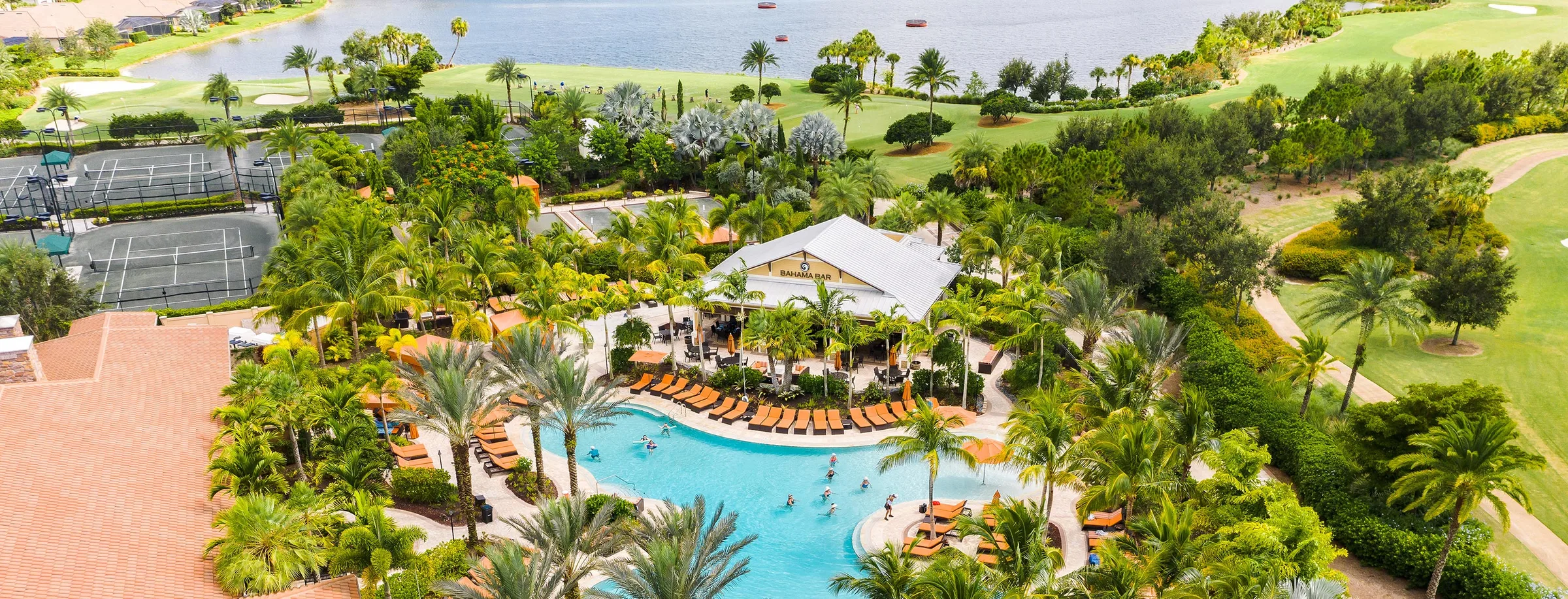 Aerial view of the clubhouse, resort pool and amenity campus at Esplanade Golf and Country Club, Naples.