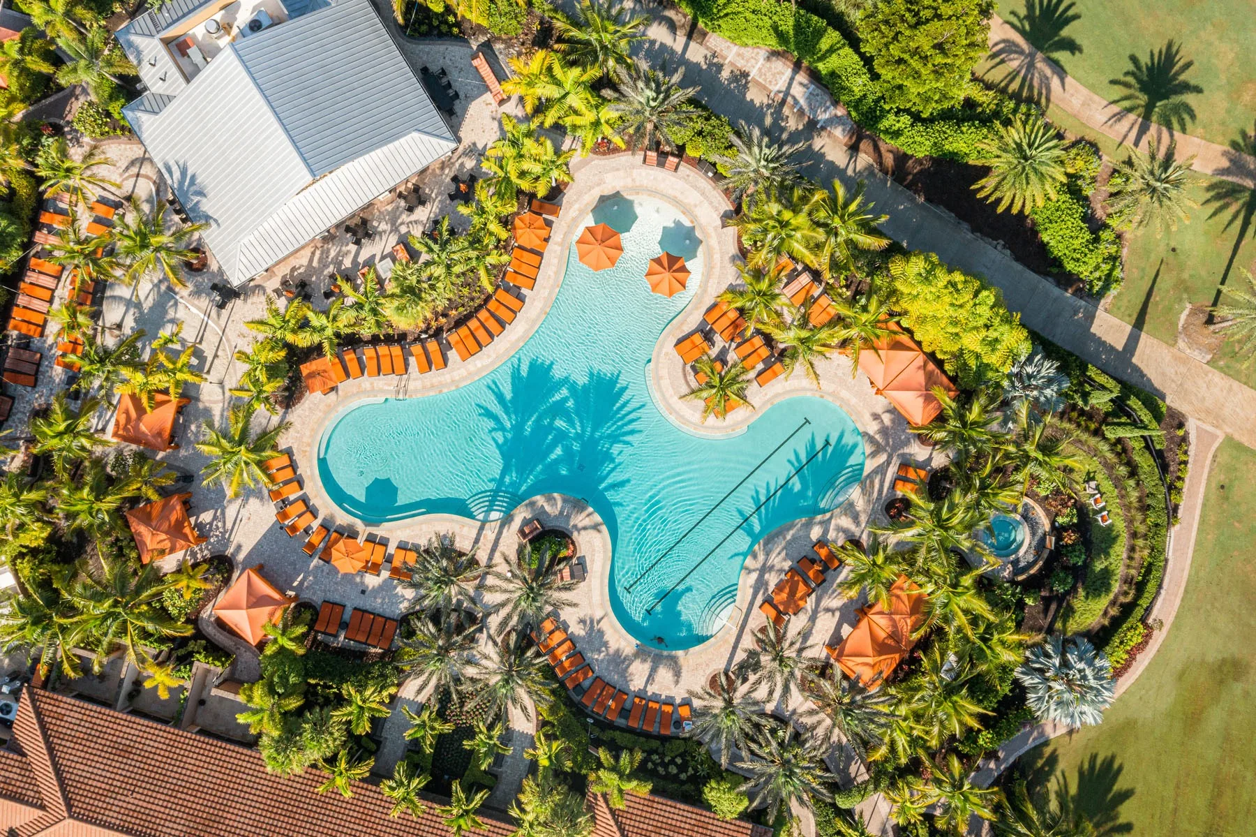 Aerial of the resort pool and cabanas at Esplanade Golf and Country Club, Naples (official club site).