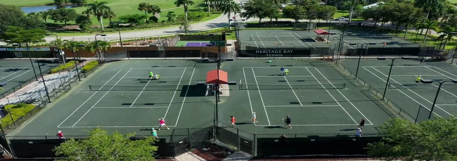 Aerial of the Har-Tru tennis complex at Heritage Bay, Naples (official club site).