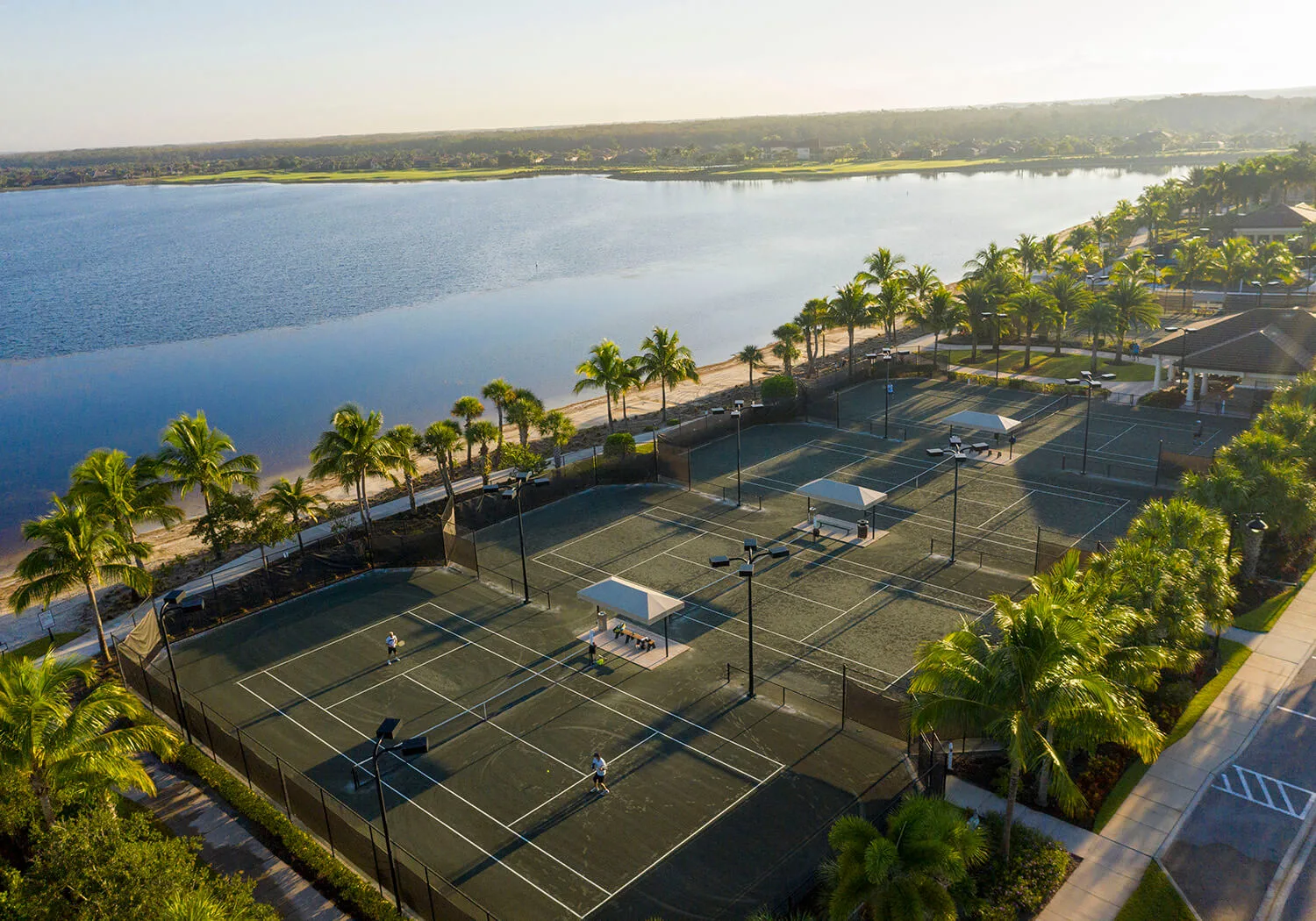 Tennis complex beside the lake at The Quarry, Naples (official club site).