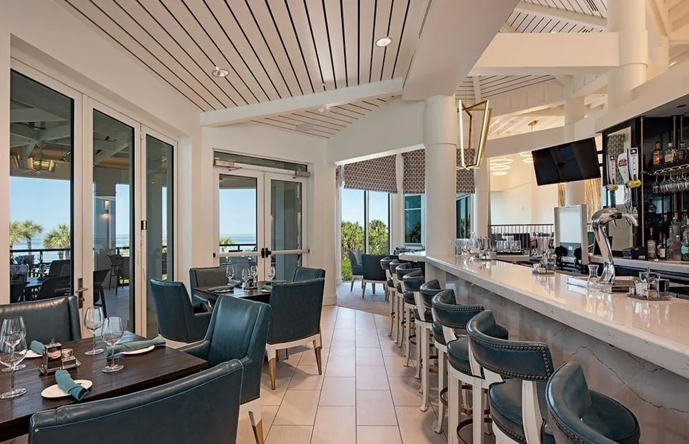 Bay Colony Beach Club bar and dining room with Gulf views