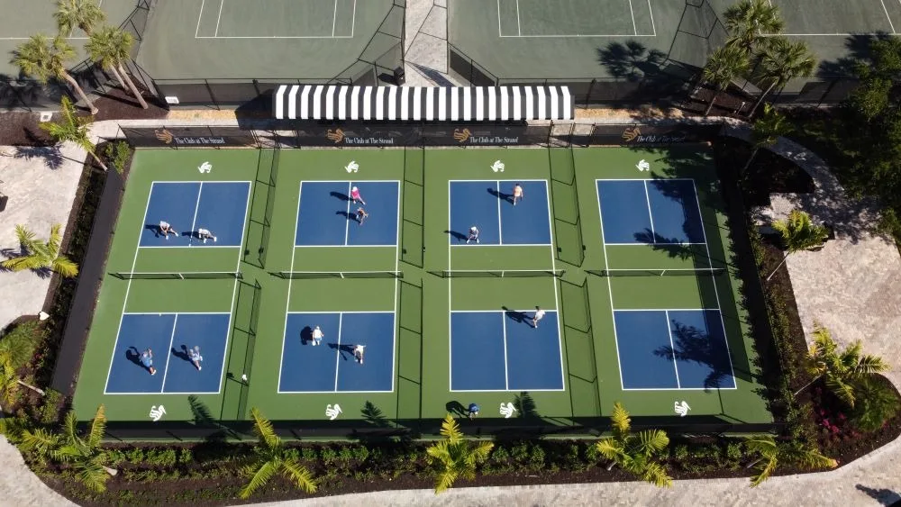 Aerial of the pickleball courts at The Strand, Naples (official club site).
