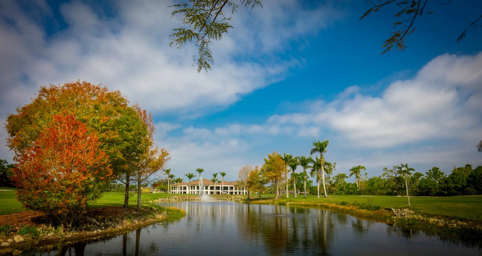 Clubhouse across the lake at Wyndemere Country Club, Naples (official club site).