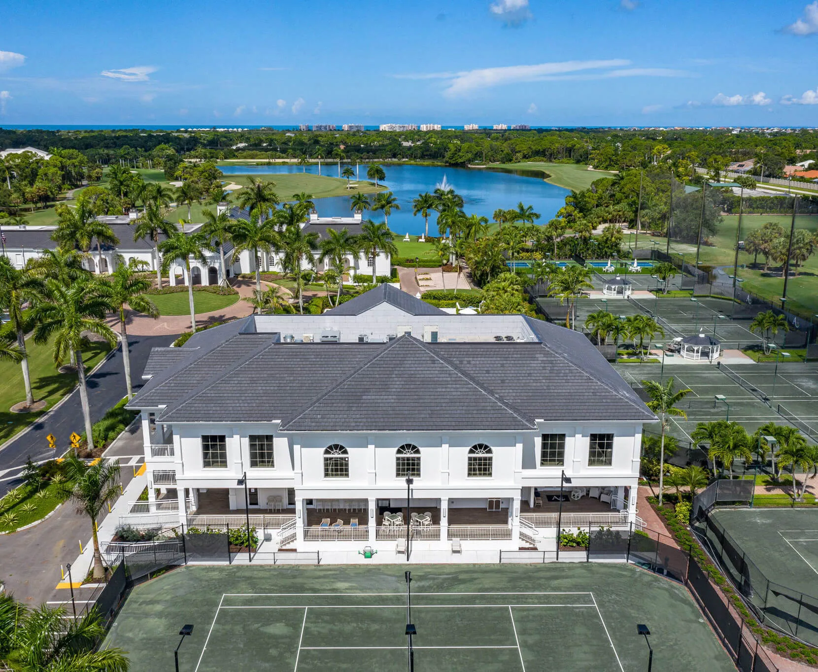 Aerial view of the clubhouse and tennis courts at Audubon Country Club, Naples.