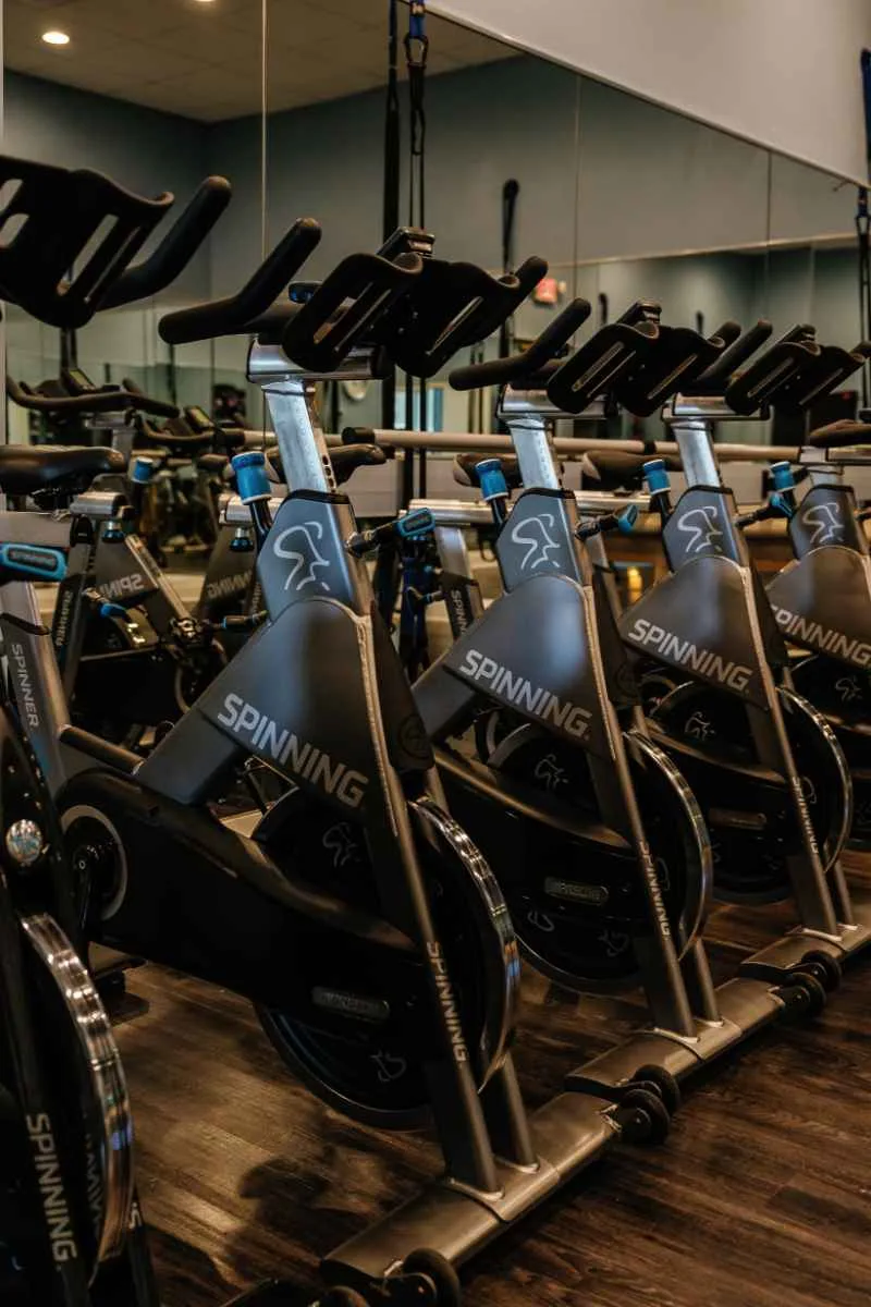 Row of spin bikes in the fitness center at Kensington Golf and Country Club, Naples.