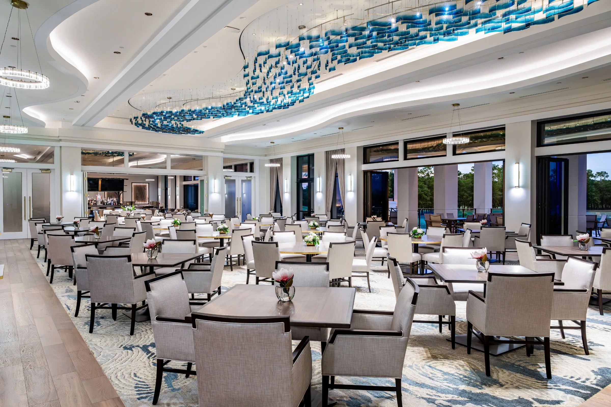 Clubhouse dining room with glass art ceiling at The Club at Olde Cypress, Naples (official).