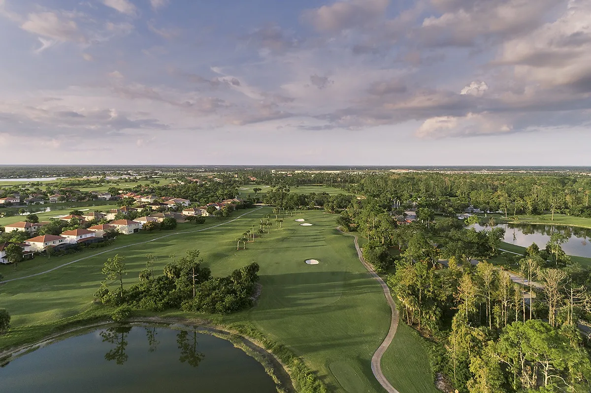Aerial of fairways and lakes at Valencia Golf and Country Club, Naples (official club site).