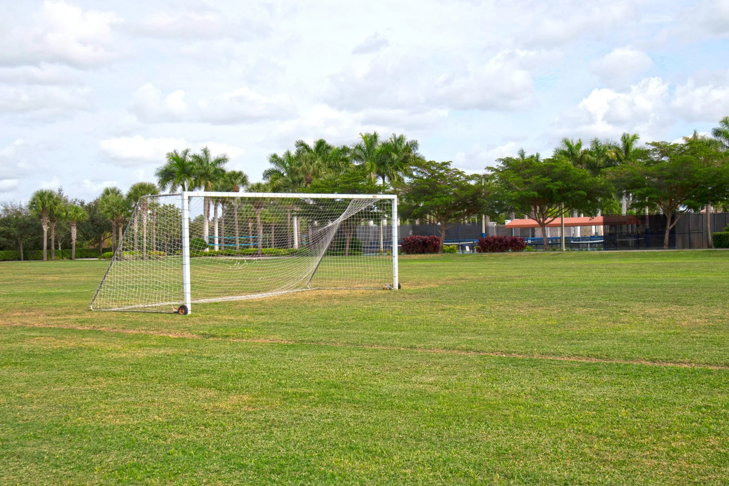 Open sports field with soccer goals at Bella Terra, Estero (official community site).