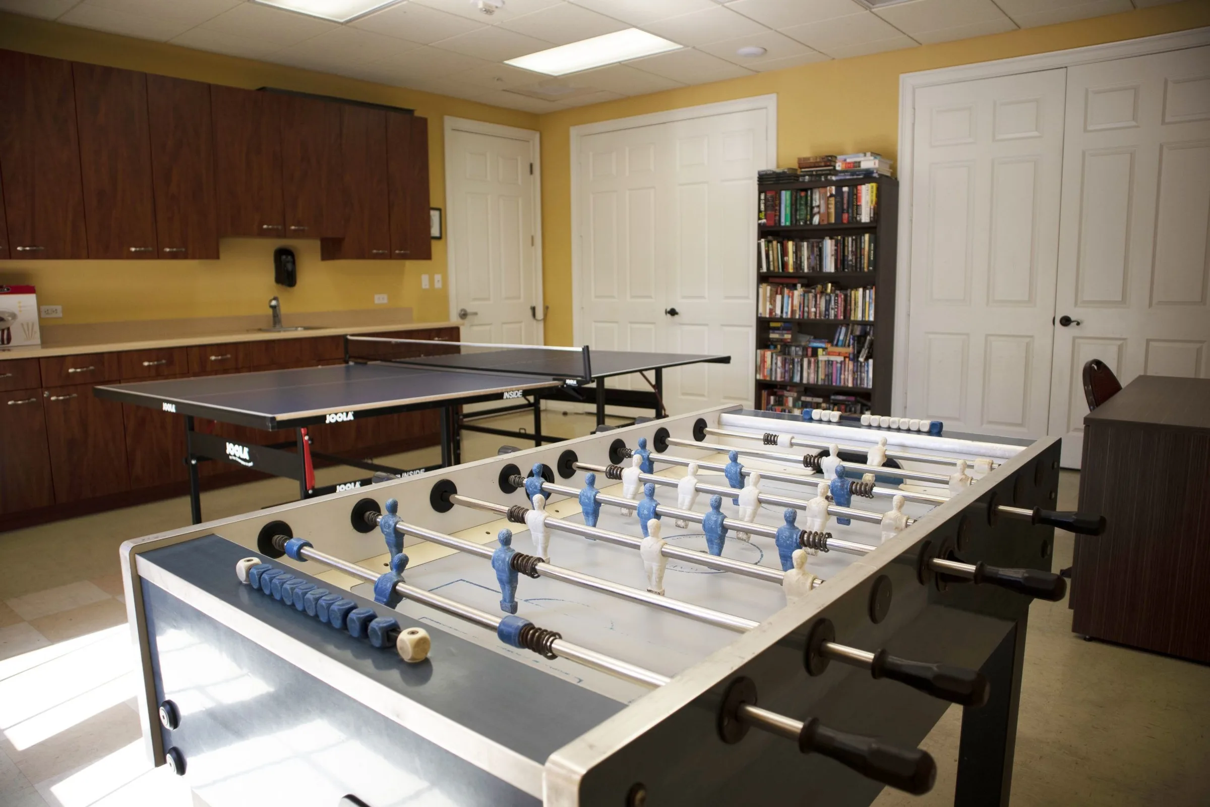 Game room with foosball tables at the Bella Terra clubhouse, Estero (official community site).