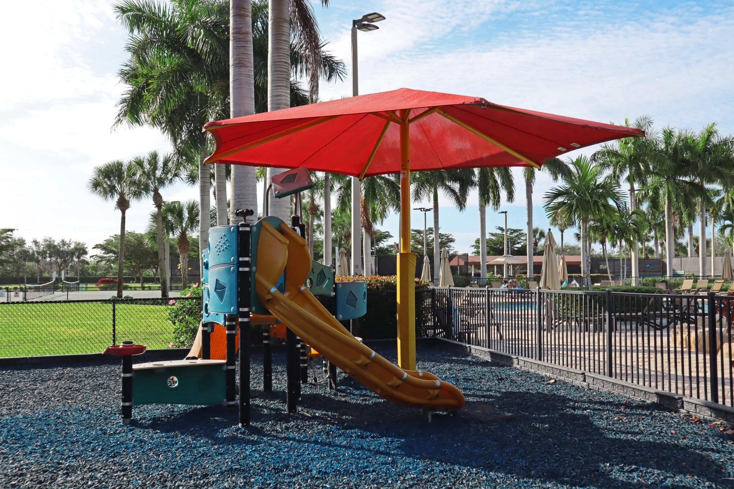 Shaded playground at Bella Terra, Estero (official community site).