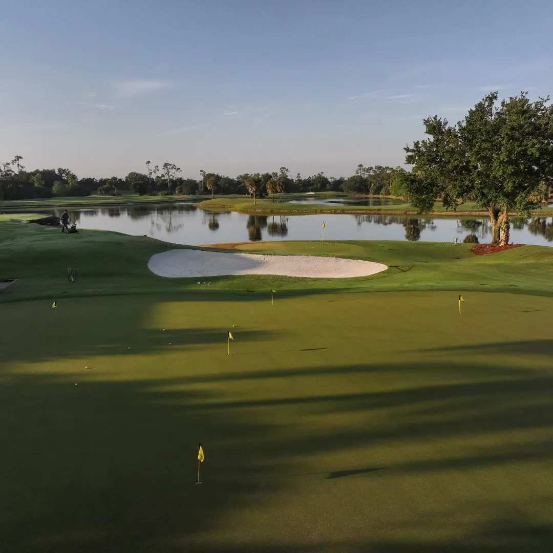 Sunset view across green and bunker at Grandezza (official club site).