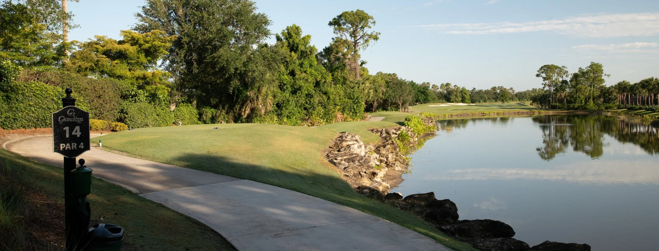 Hole 14 cart path along the lake at Grandezza (official).