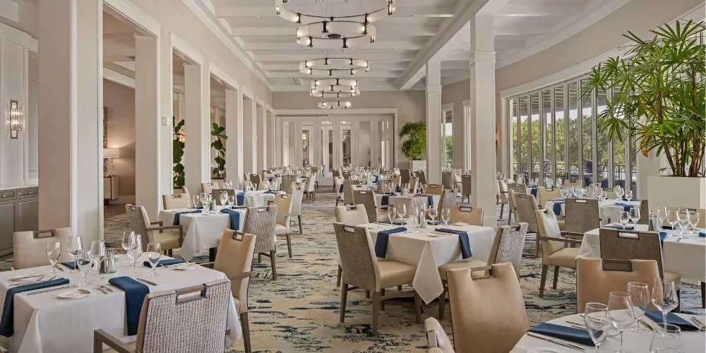 Main dining room at the West Bay Club clubhouse, Estero (official club site).