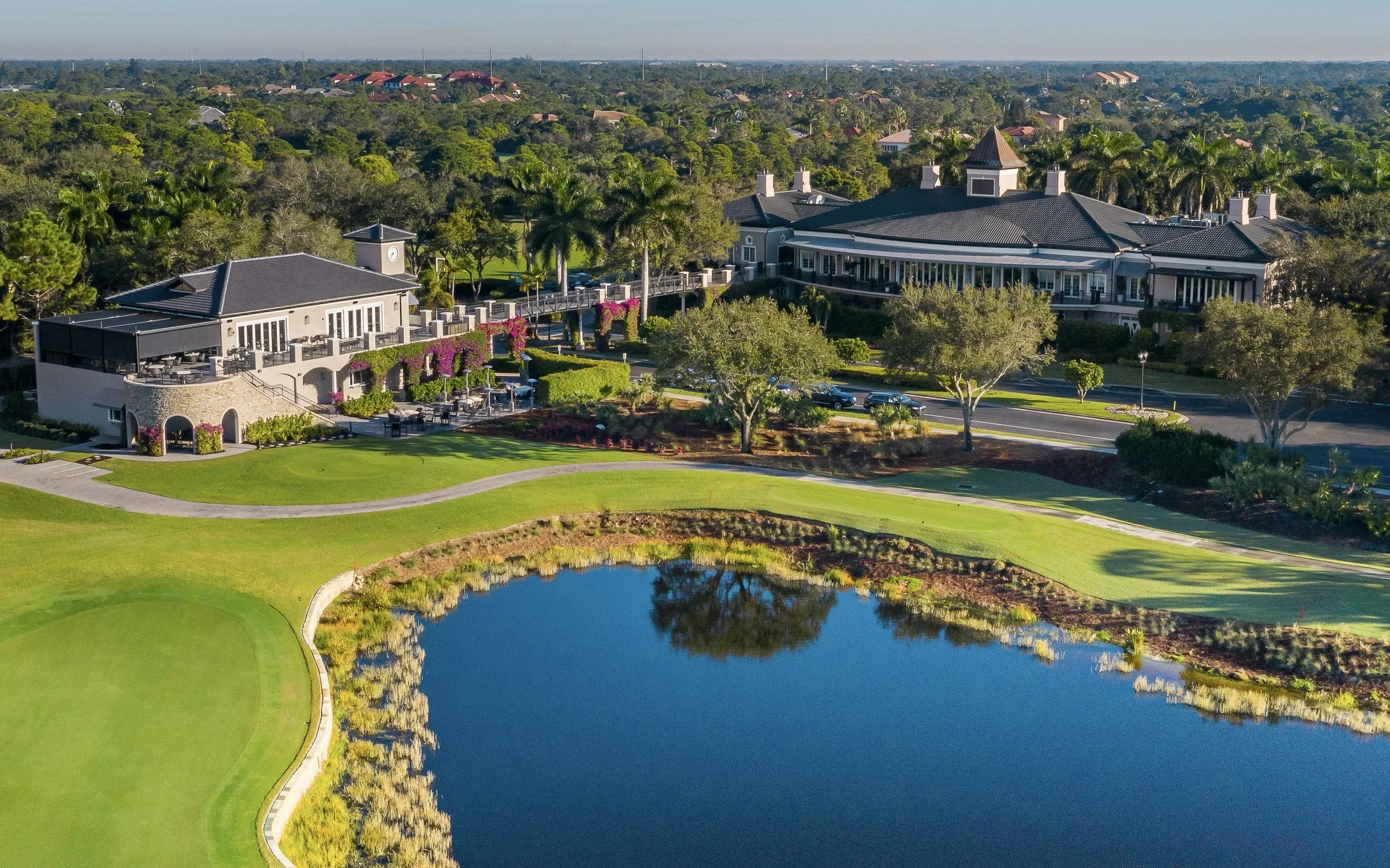 Golf hole and clubhouse at West Bay Club.